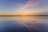 body of water under cloudy sky