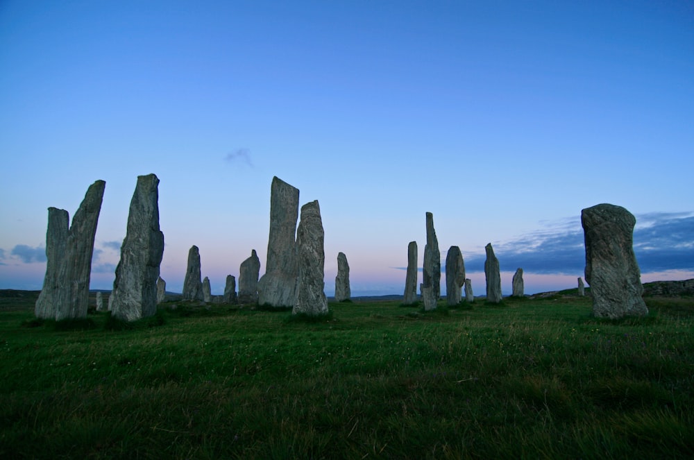 lined rocks on green grass field landmark