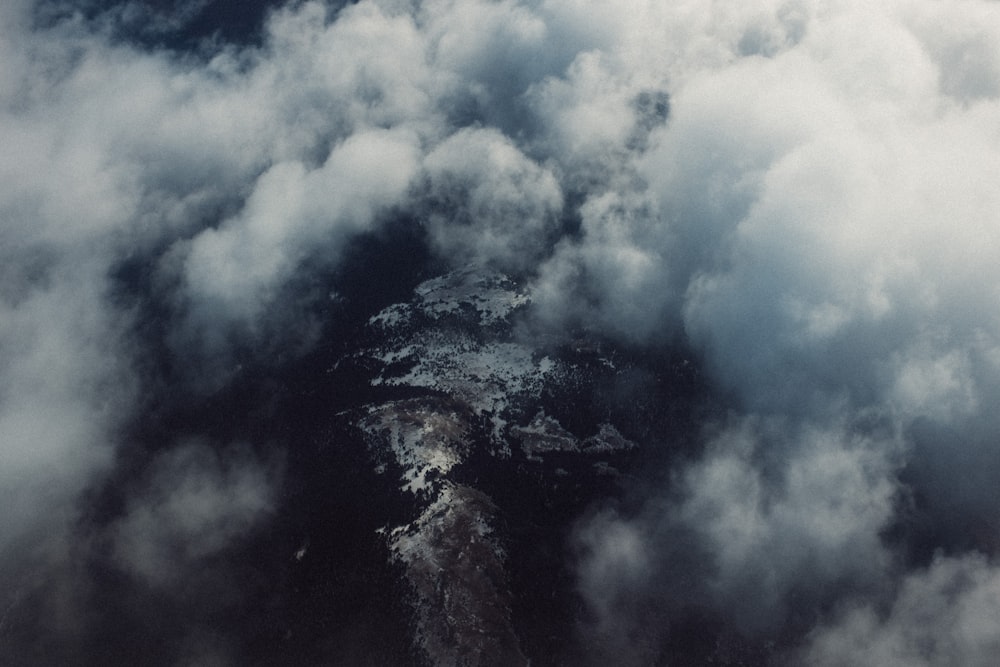 cumulus clouds over body of water