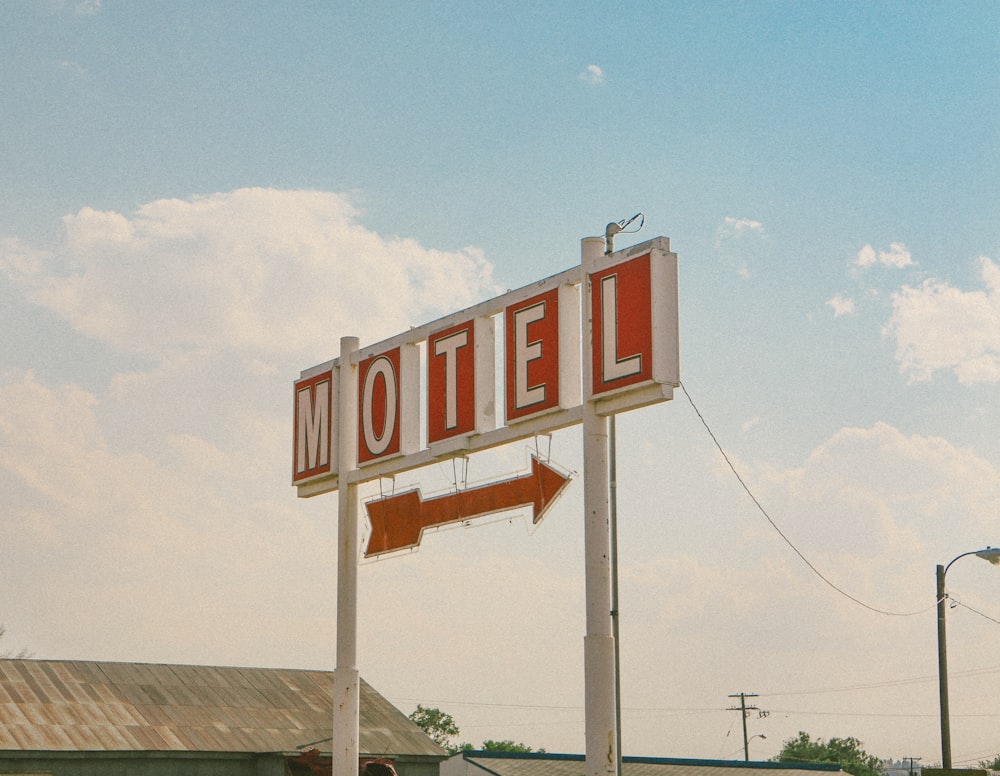red and white motel signage