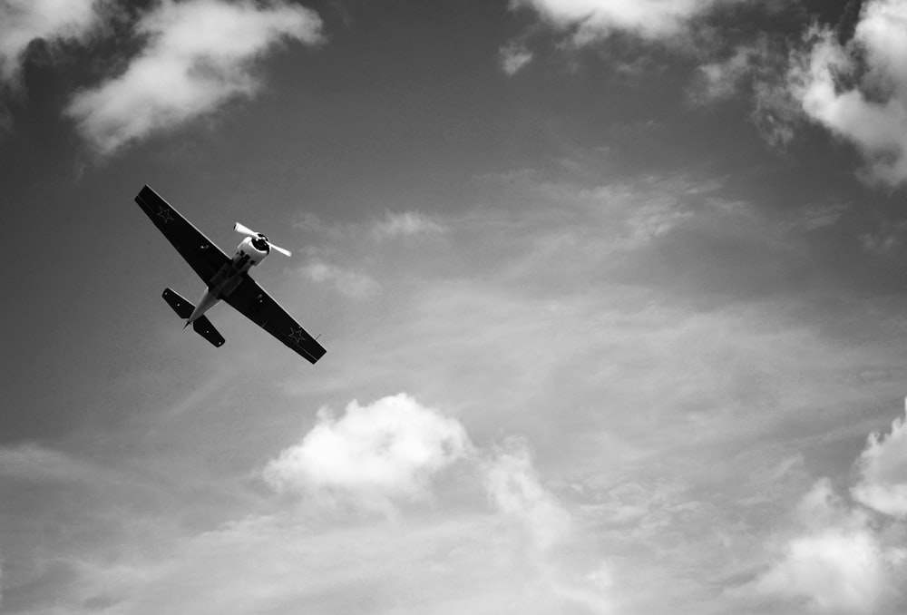 greyscale photography of plane flying