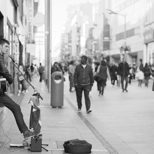 man playing musical instrument at town