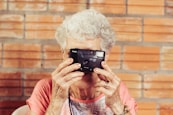woman holding film camera