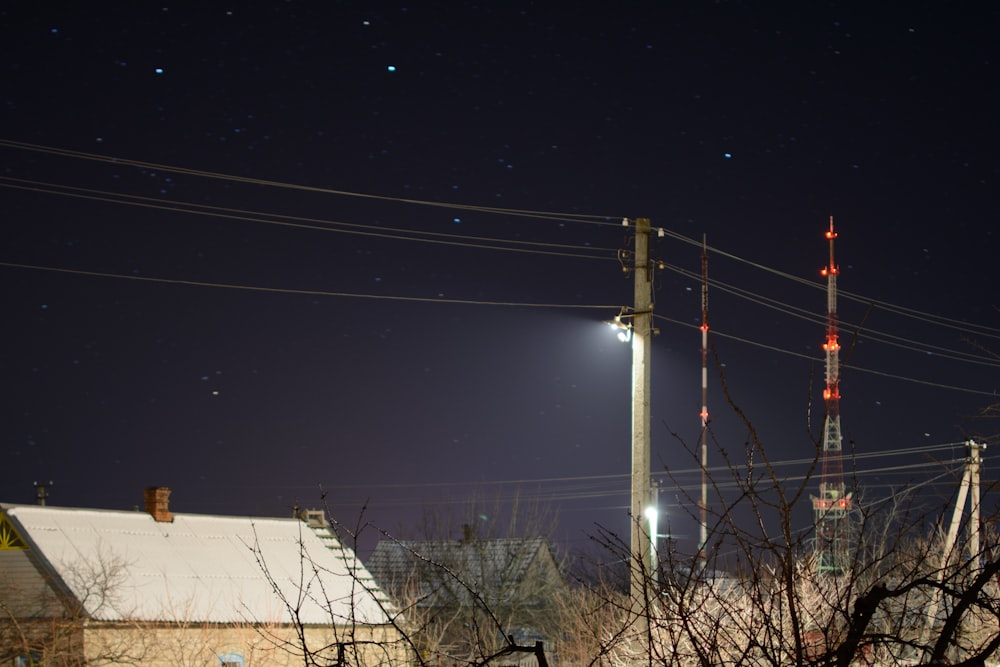 gray electric post during nighttime