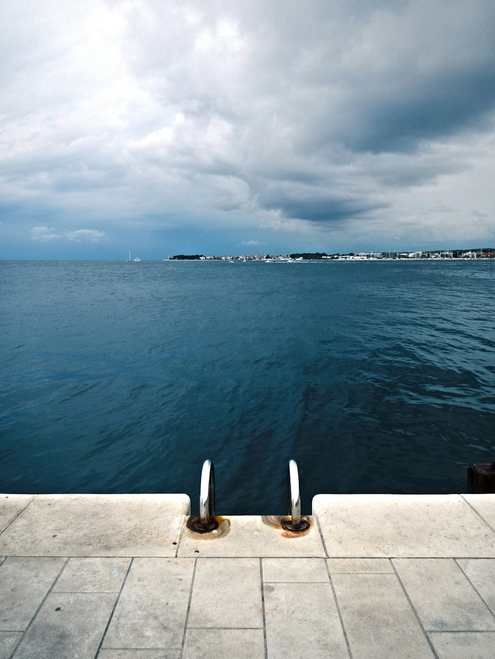 body wave of water near buildings