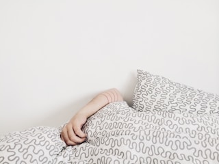 person lying on bed