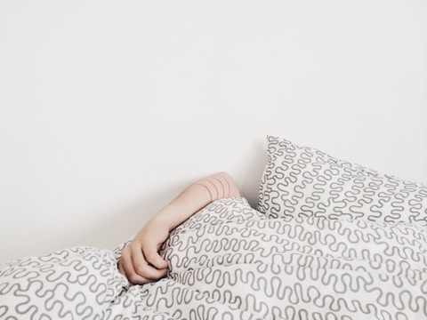 person lying on bed