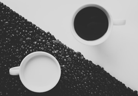 white ceramic coffee mug filled with black liquid