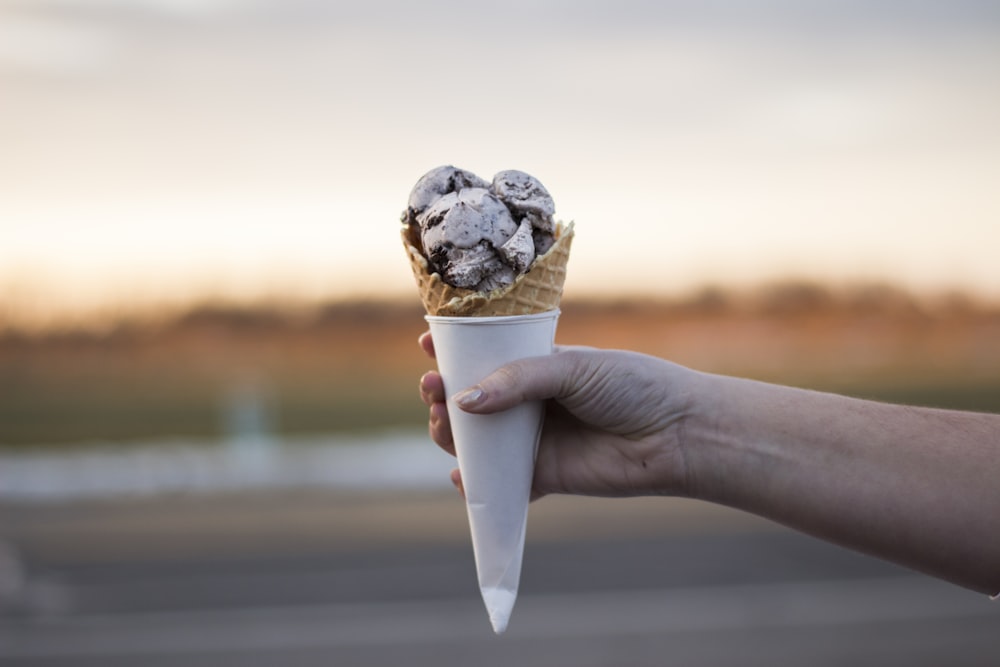 person holding ice cream