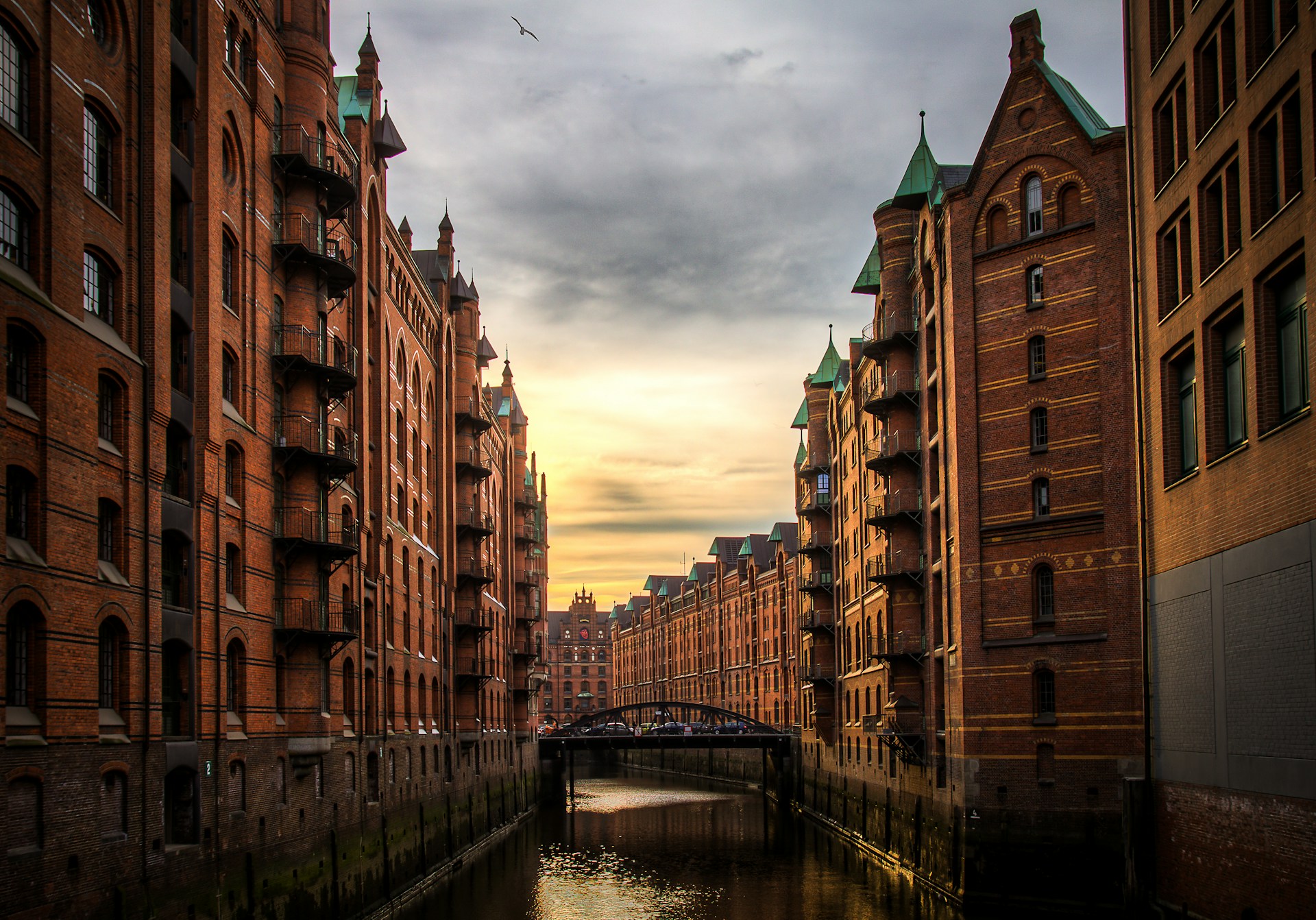 river between brown concrete buildings