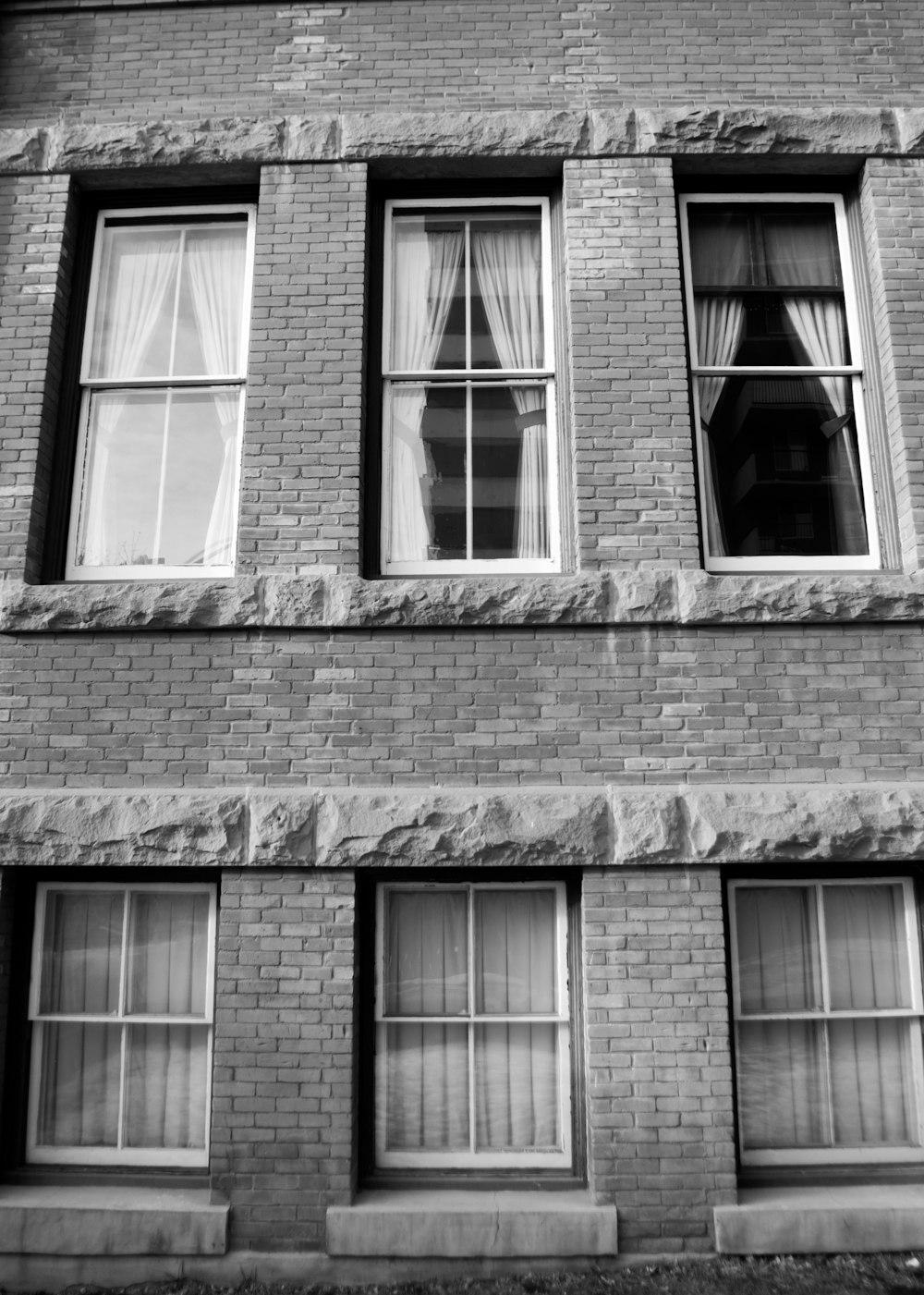grayscale photography of brick building