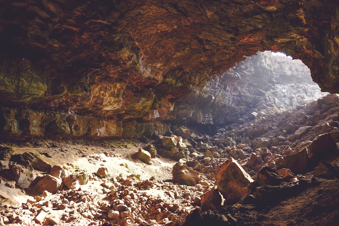 brown rock inside cave, Illuminated rocky cavern