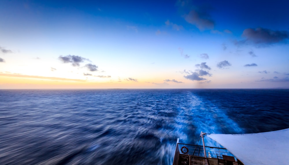 white boat passing through the sea