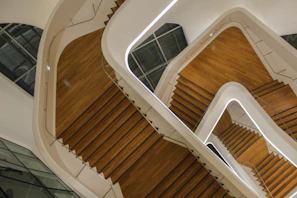Architectural detail of a staircase with geometric shapes and smooth surfaces