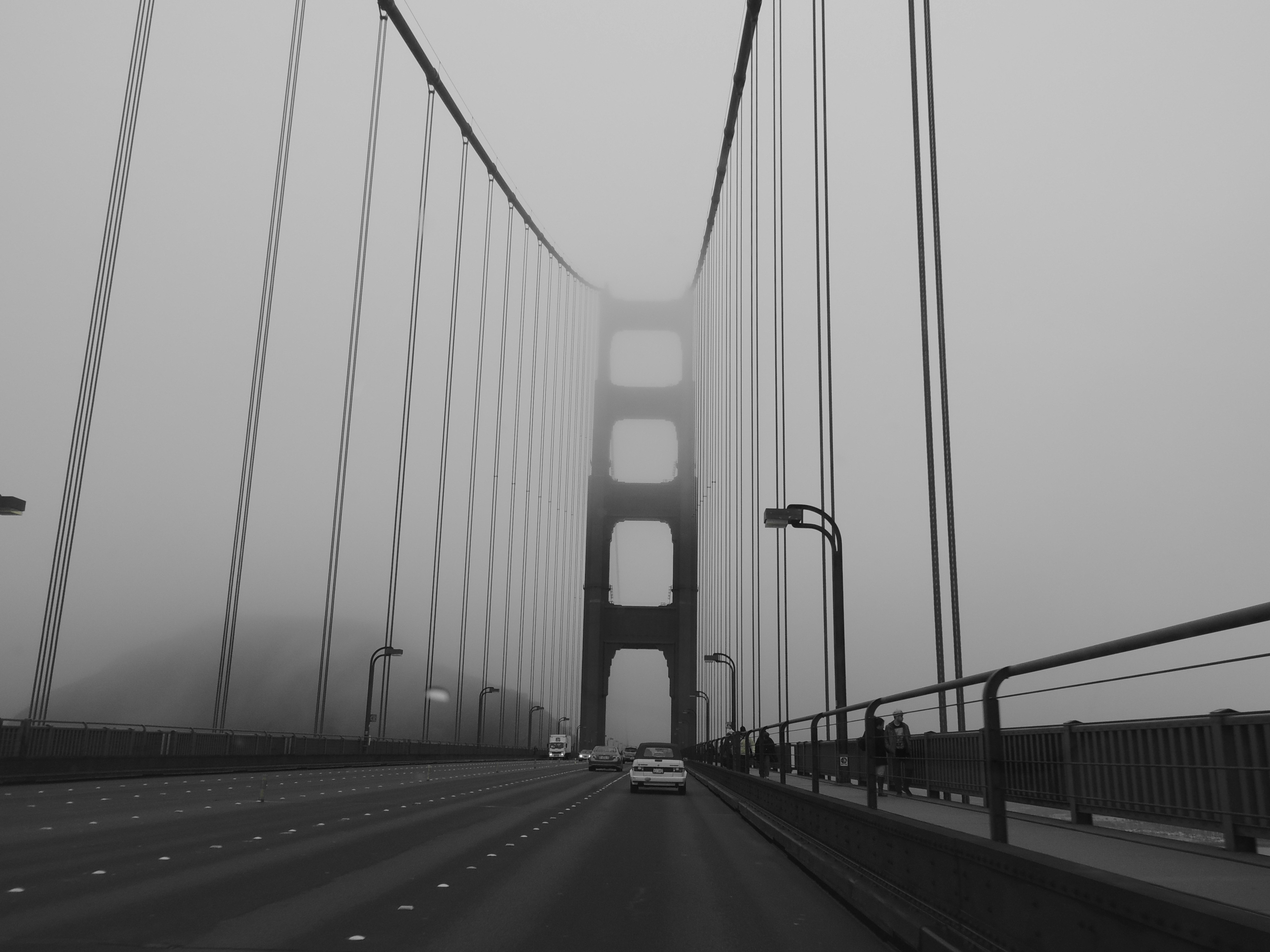 cars on bridge grayscale photo