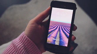 A warm, friendly mobile screen showing Pinkfinity’s clean pink and white login page with a glowing OTP button.