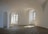 Soft natural light illuminating a calm spa room with minimalist decor and plants.