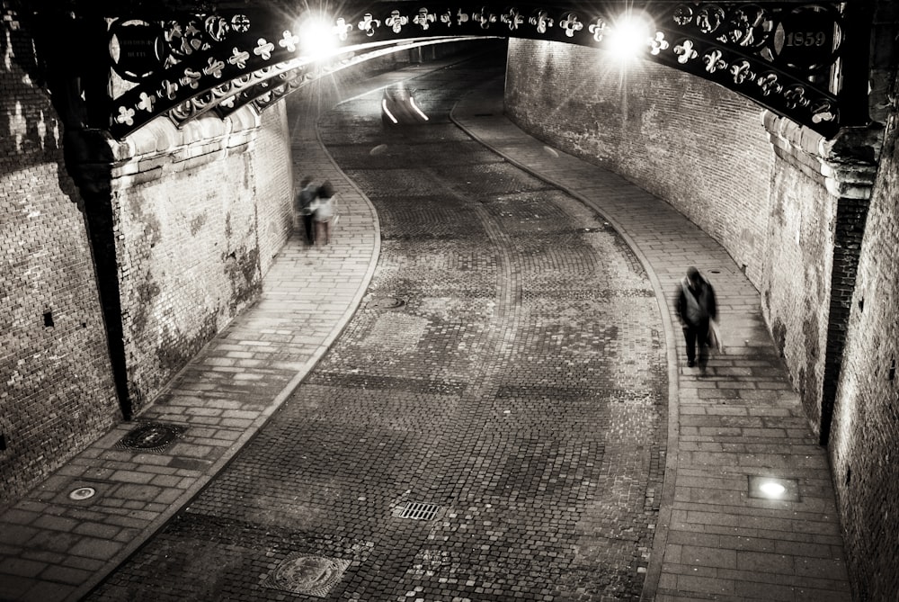 gray-scale photo of man walking