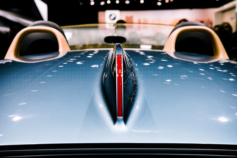 closeup photography of blue vehicle hood