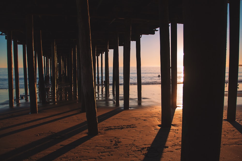 silhouette photo of sea dock