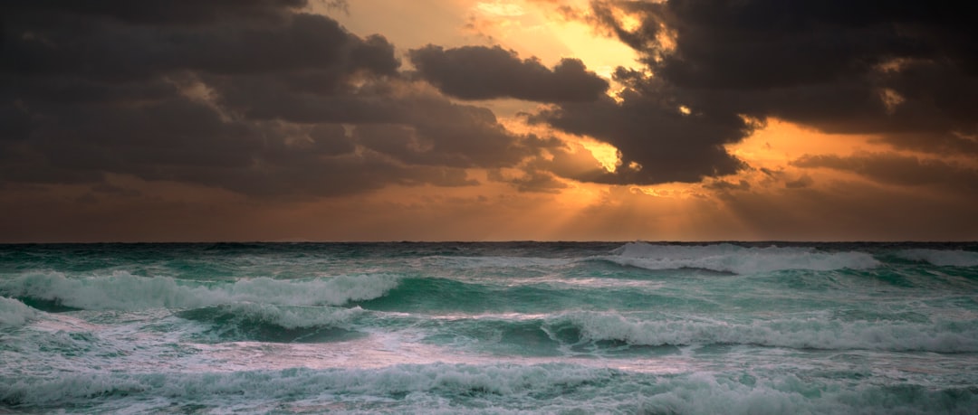 photography of ocean waves during golden hour