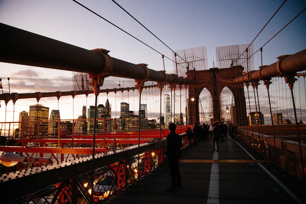 people standing on Brooklyn Bridge