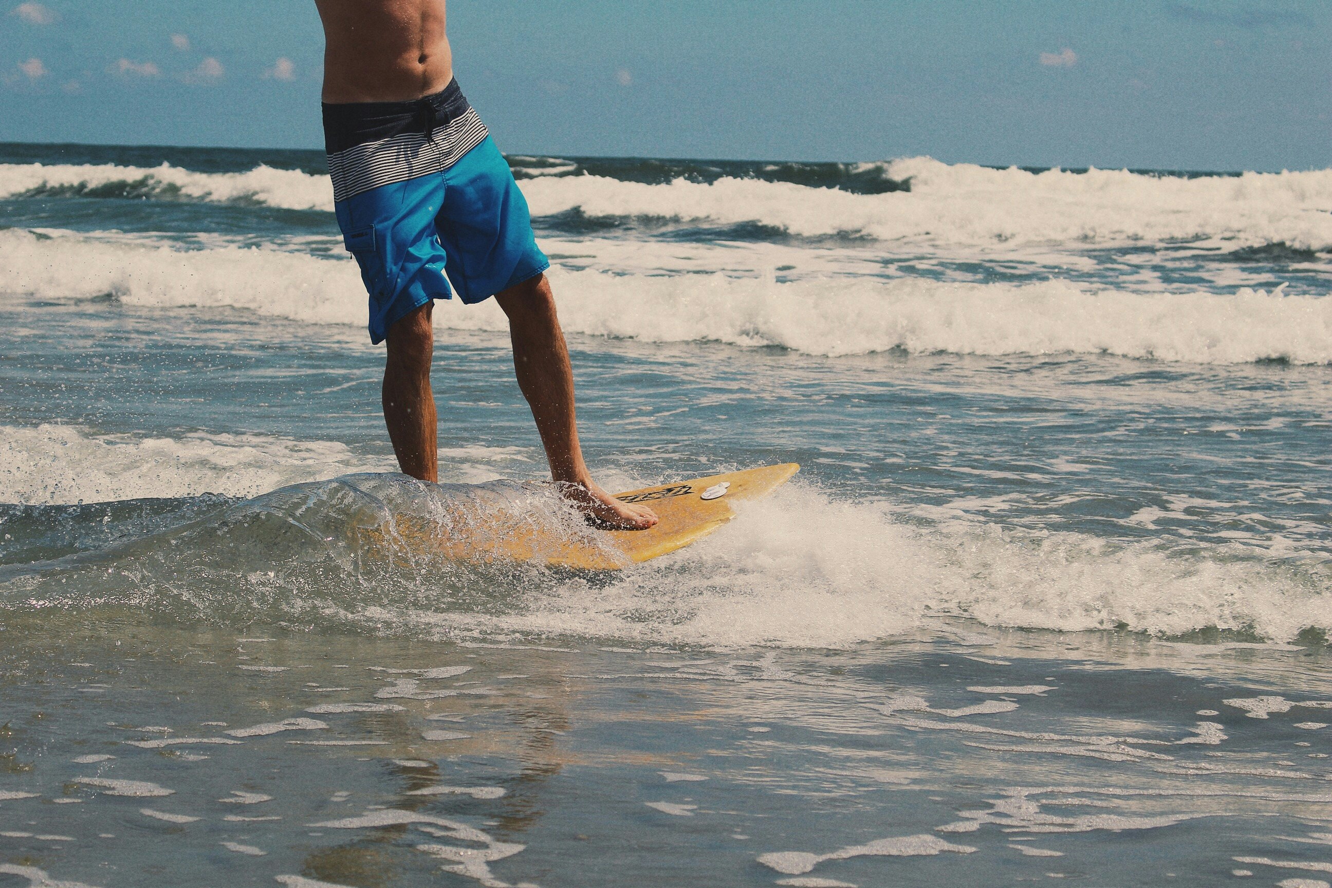 man surfing on sea