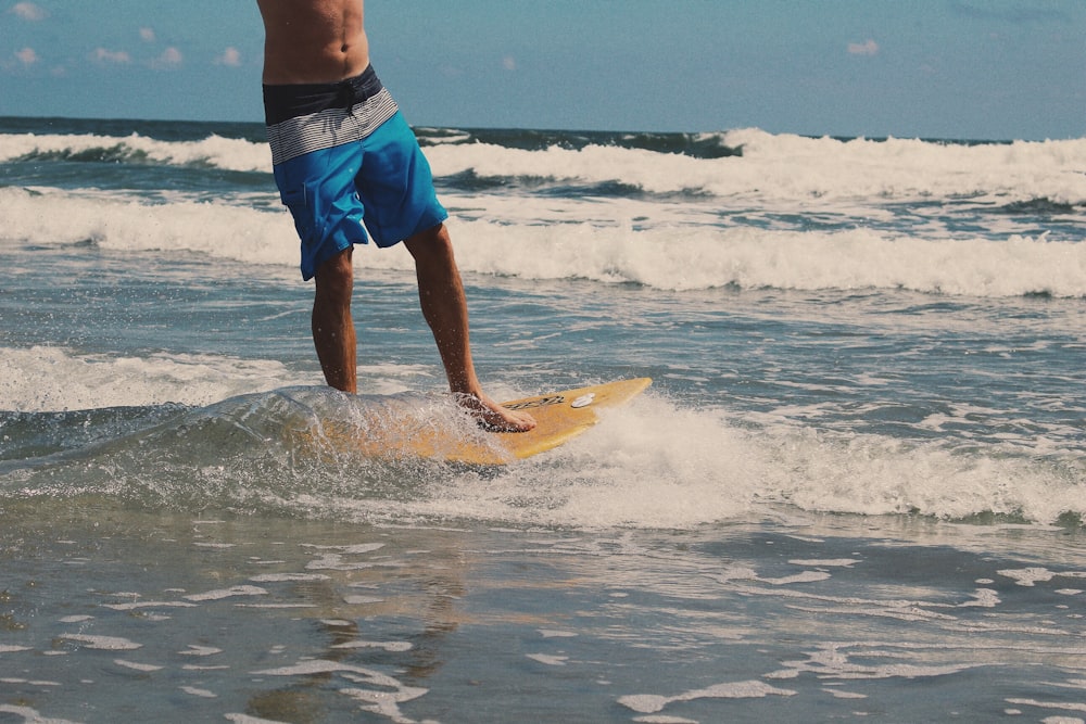 man surfing on sea