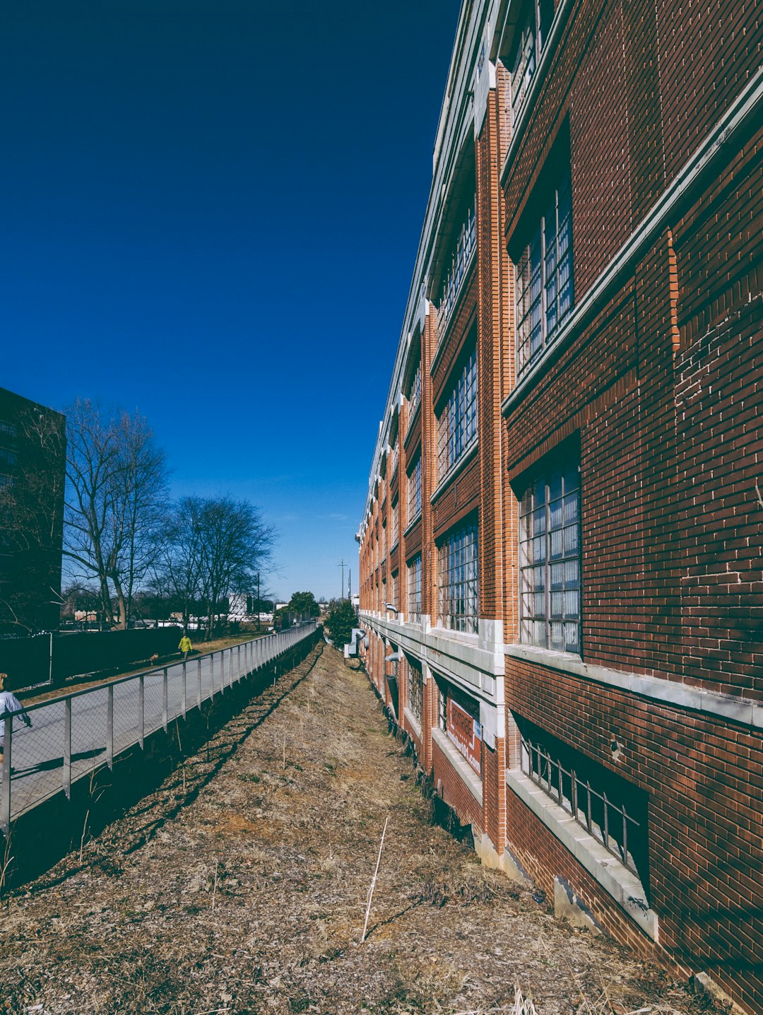 brown brick building under blue sky during daytime