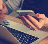 woman holding silver iPhone 6