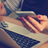 woman holding silver iPhone 6