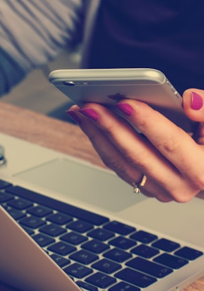 woman holding silver iPhone 6