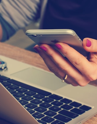 woman holding silver iPhone 6