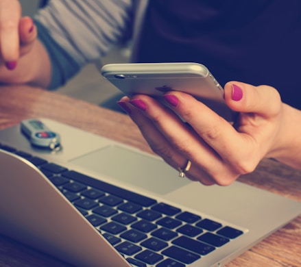 woman holding silver iPhone 6