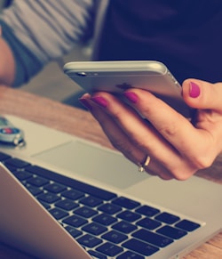 woman holding silver iPhone 6