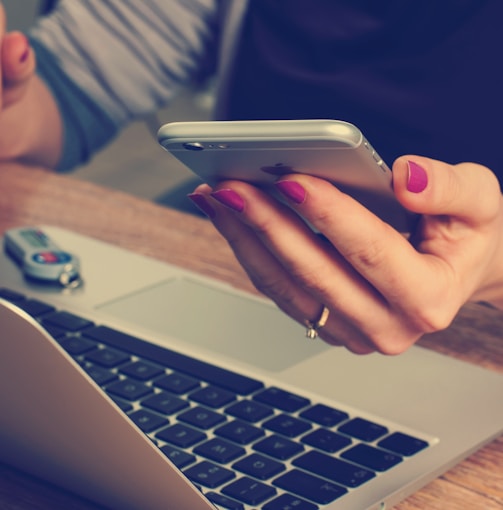 woman holding silver iPhone 6