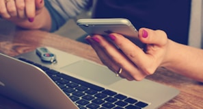 woman holding silver iPhone 6