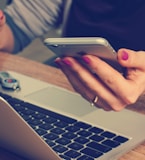 woman holding silver iPhone 6