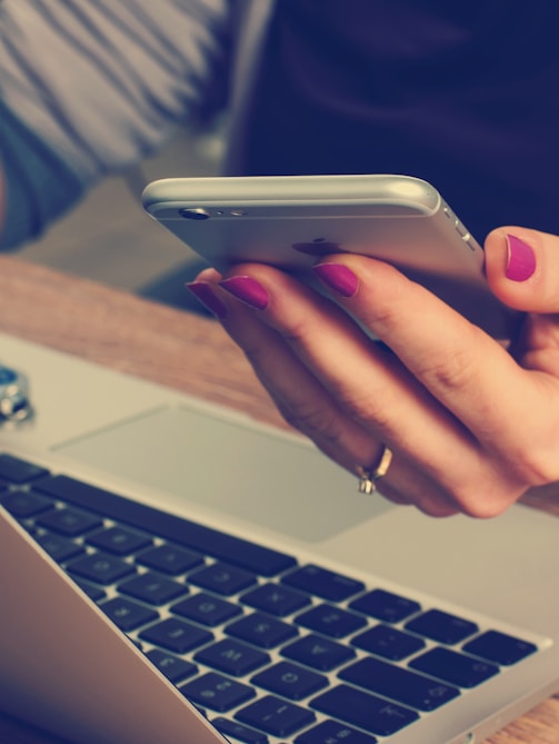 woman holding silver iPhone 6