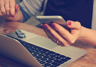 woman holding silver iPhone 6