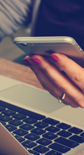 woman holding silver iPhone 6