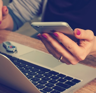 woman holding silver iPhone 6