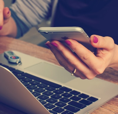 woman holding silver iPhone 6