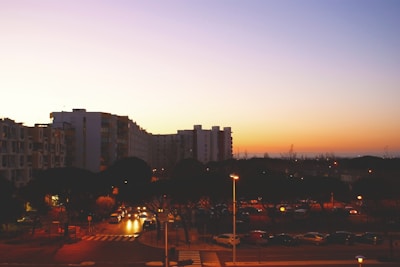 A cityscape of New York with apartment buildings at sunset.