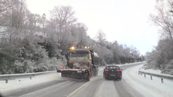 Snow removal in action on a residential driveway in Vail, showcasing clear paths and safety.