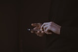 silhouette photo of person holding smartphone