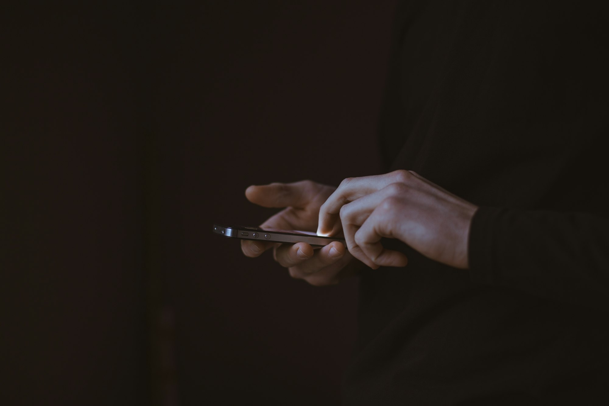 unidentified user engaging with a mobile device