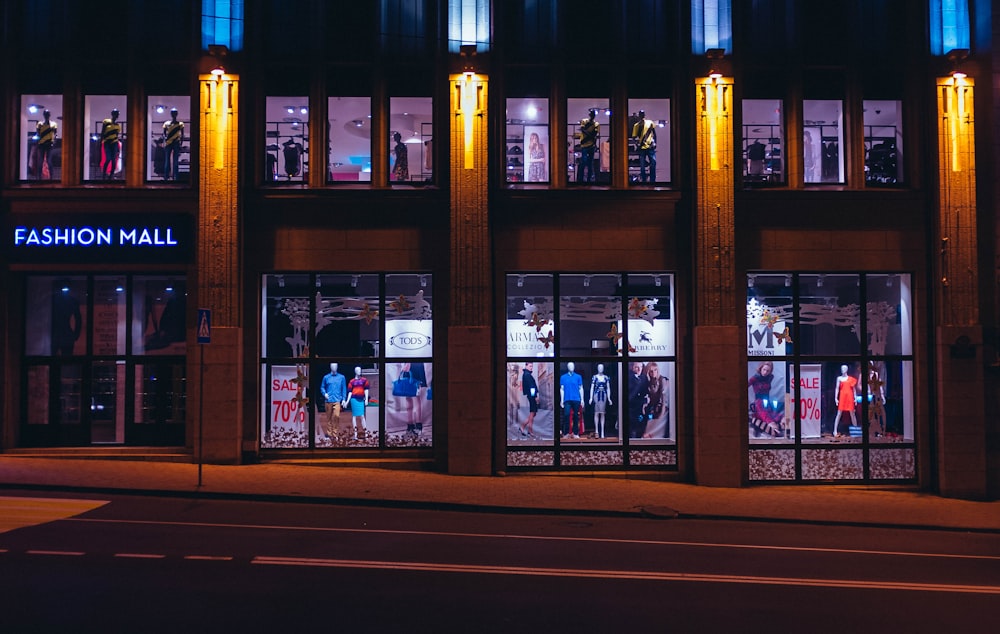 brown Fashion Mall store front photo at nighttime