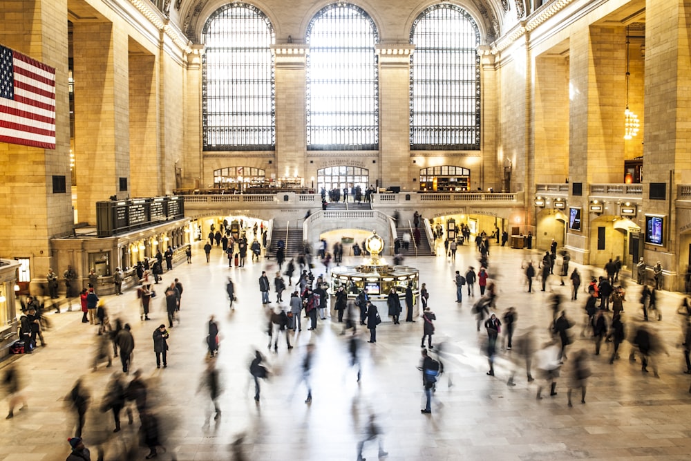 time lapse photography of group of people inside building