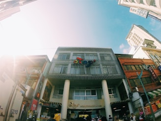 A freshly painted commercial building facade with clean sidewalks and bright signage.